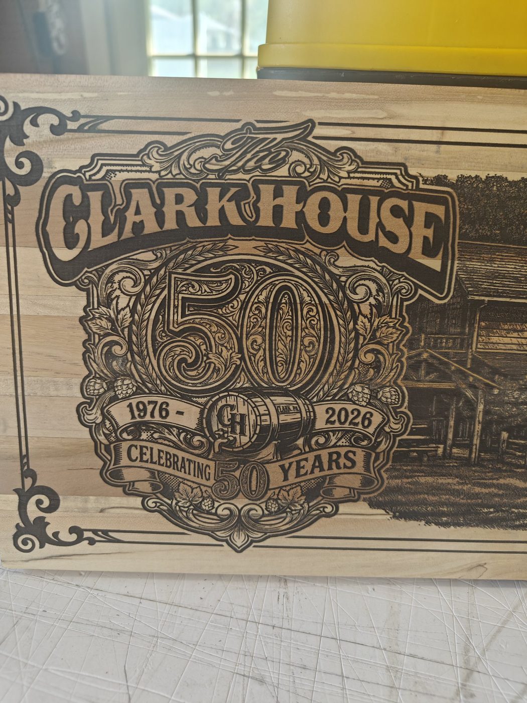 Engraved anniversary board — Anniversary crest & building scene