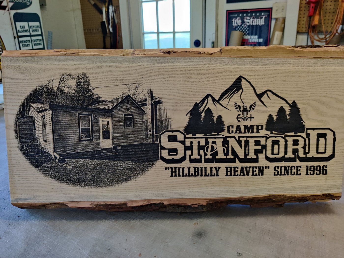 Live-edge camp sign — Cabin photo on live-edge wood